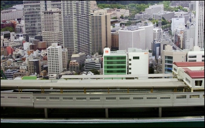  “subway” line) to the commercial buildings and backdrop